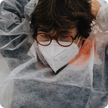 A non-emergency medical transportation worker with a mask