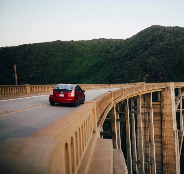 A car driving over a bridge
