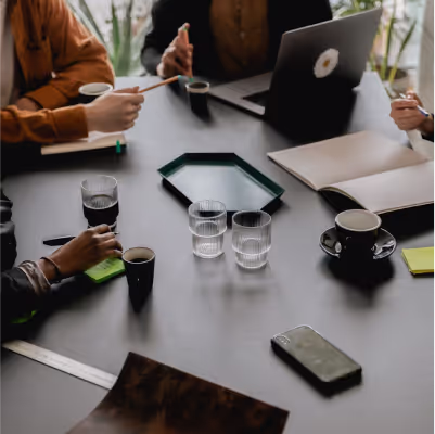 A group of people talking during a meeting